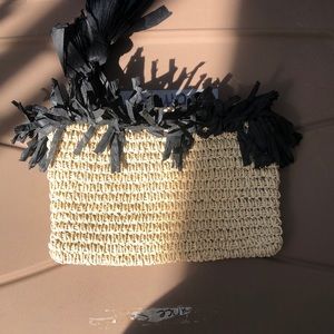 Tan and black clutch